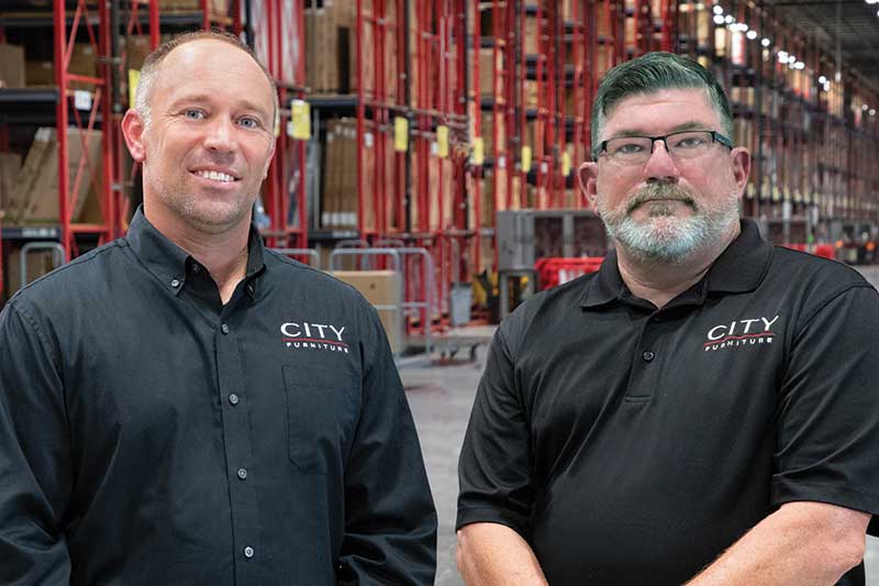 For Shaun Feraco, senior vice president of operations (left) and David Clevenger, senior vice president of fleet and DC maintenance for City Furniture, lithium-powered lift trucks deliver outcomes like higher fleet productivity as well as more space for storage.